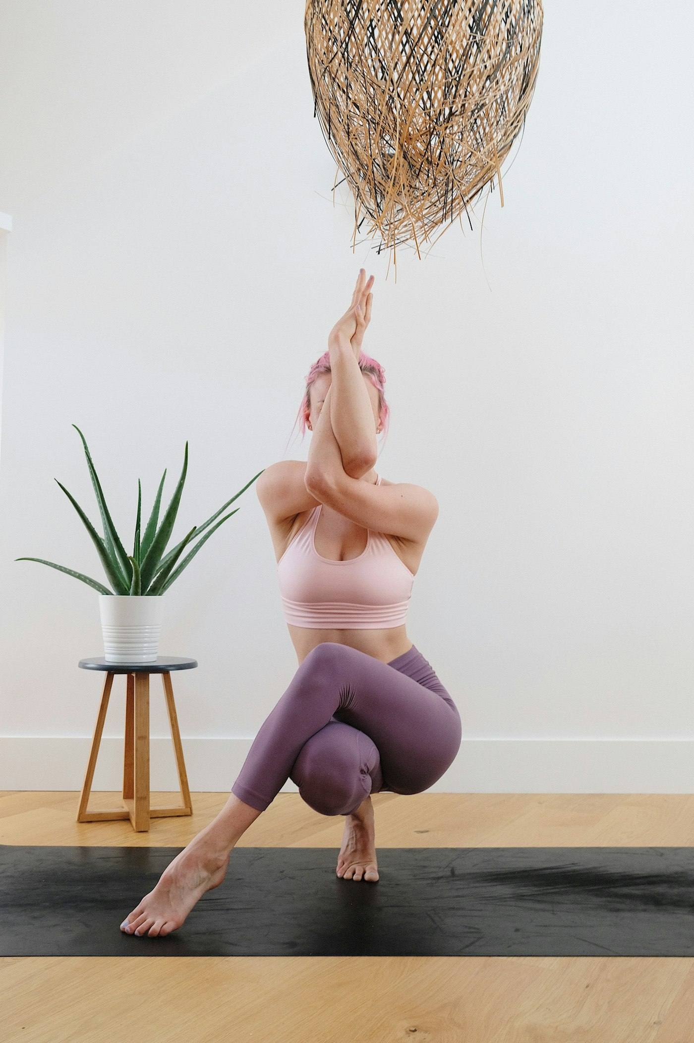 A woman practising yoga at home